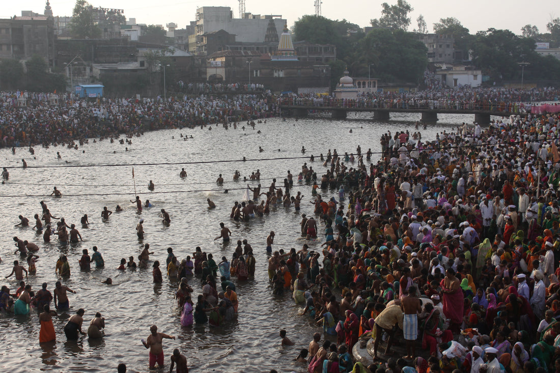 Millions of Warkaris bathing in the Bhima river at Pandharpur during Ashadhi Ekadashi Wari — photographed by Vinod Gupta, 2011